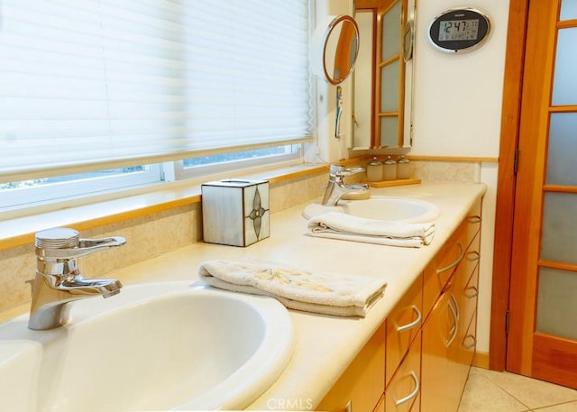 bathroom with tile patterned flooring and vanity