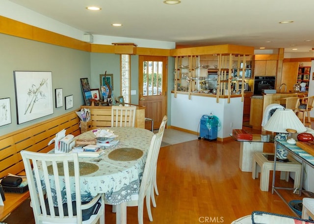 dining room with light wood-type flooring