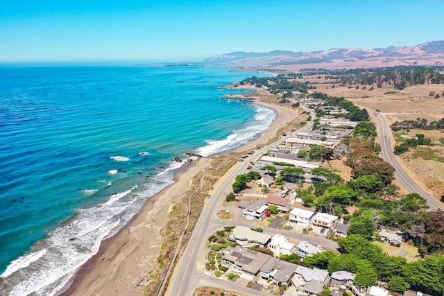 bird's eye view with a water and mountain view and a beach view