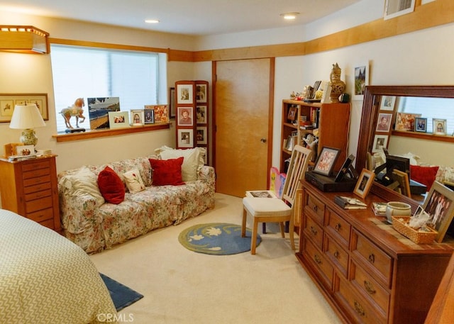 carpeted bedroom with a closet