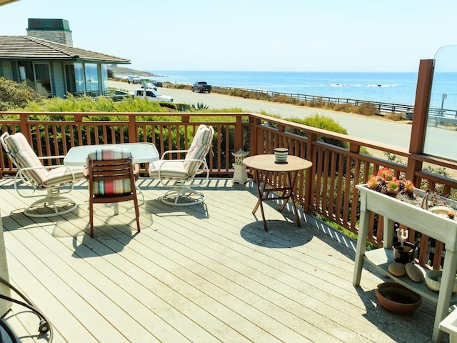 wooden deck with a water view