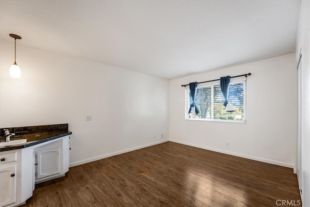 interior space with sink and dark hardwood / wood-style flooring