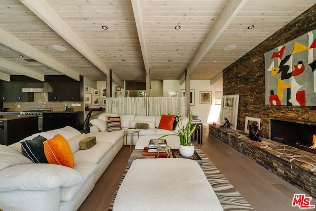 living room with beamed ceiling, dark hardwood / wood-style flooring, a fireplace, and wood ceiling