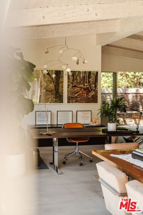 home office with vaulted ceiling with beams and wooden ceiling