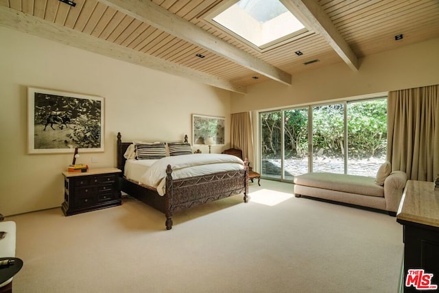 carpeted bedroom featuring beamed ceiling, access to outside, a skylight, and wooden ceiling