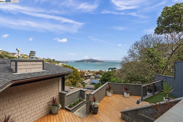 wooden deck with a water view