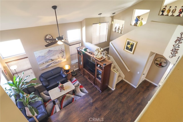 living room featuring ceiling fan, dark hardwood / wood-style flooring, and high vaulted ceiling