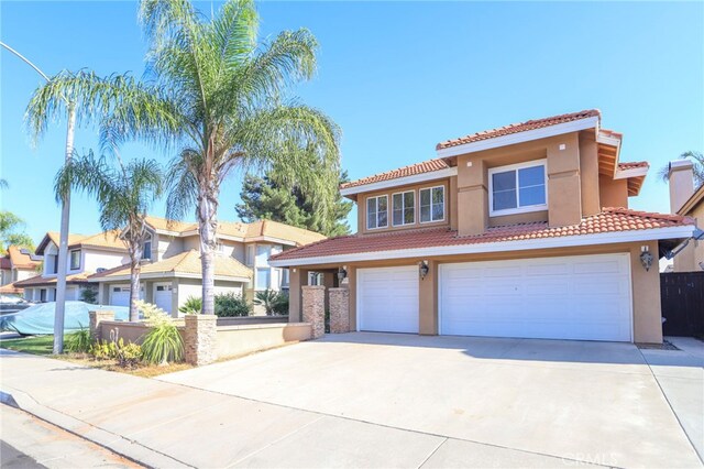 mediterranean / spanish-style home featuring a garage