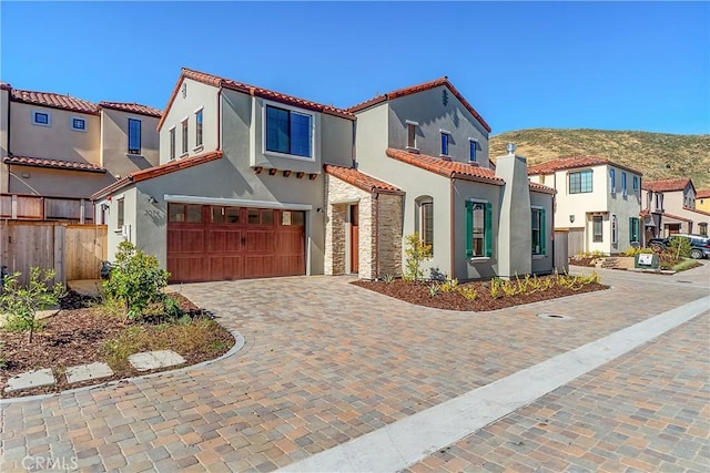 mediterranean / spanish house featuring a garage