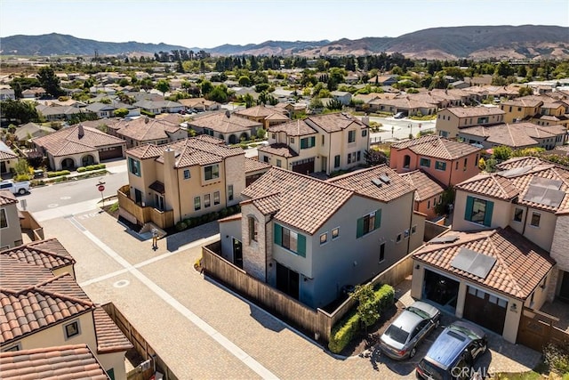 birds eye view of property with a mountain view