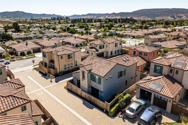 aerial view with a mountain view and a residential view