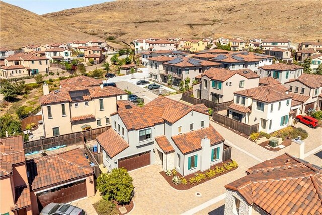 drone / aerial view featuring a mountain view and a residential view