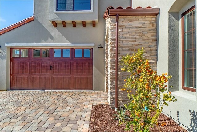 exterior space with decorative driveway