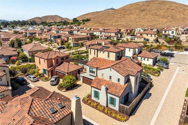 birds eye view of property with a mountain view