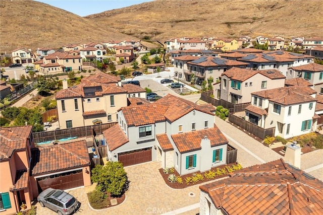 drone / aerial view with a mountain view and a residential view