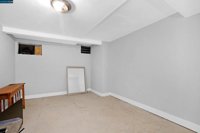 basement featuring light colored carpet