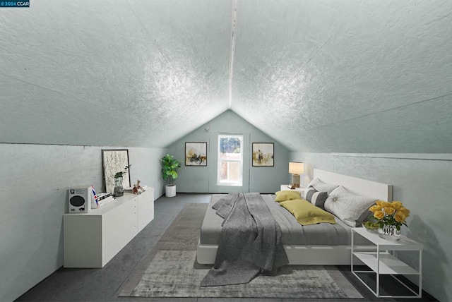 bedroom featuring lofted ceiling and a textured ceiling