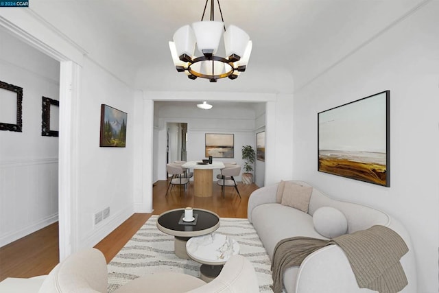 living room featuring a chandelier and hardwood / wood-style flooring