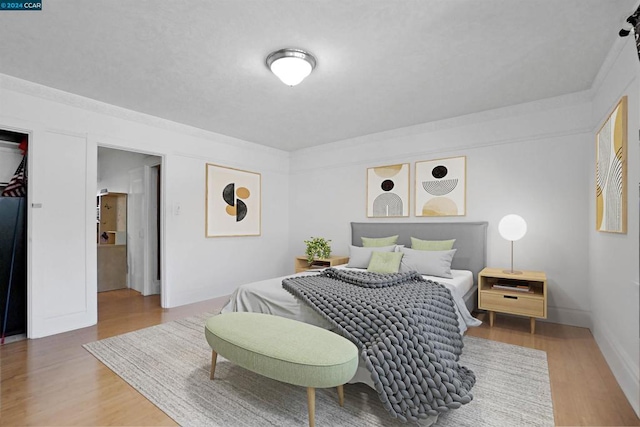 bedroom featuring hardwood / wood-style flooring