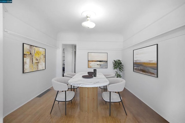 dining room with hardwood / wood-style flooring