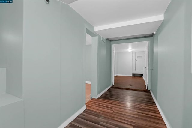 corridor with dark wood-type flooring