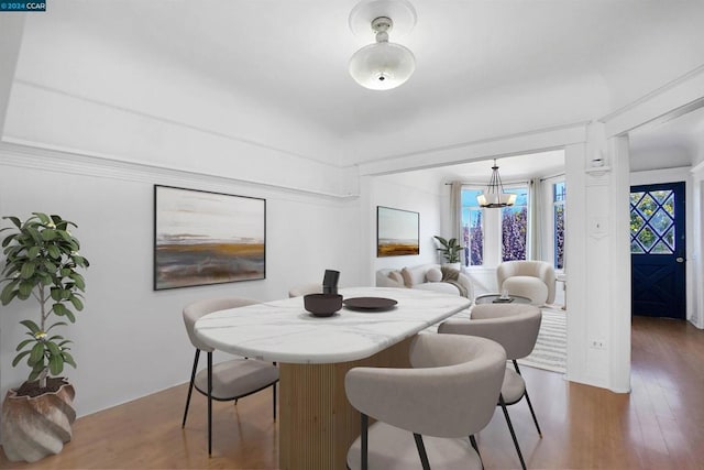 dining space featuring a chandelier and hardwood / wood-style flooring