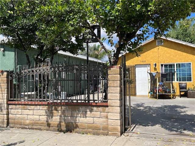 view of gate featuring fence