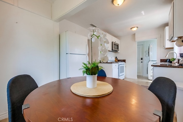 tiled dining area with sink