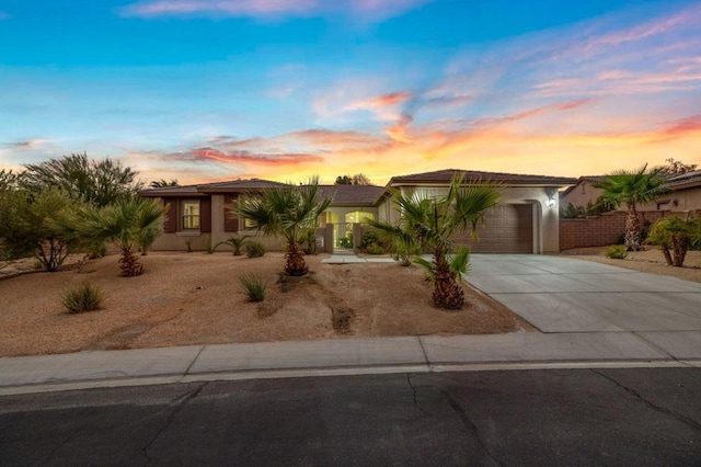 view of front of property with a garage