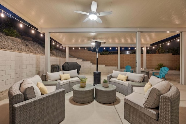 interior space featuring an outdoor hangout area and ceiling fan