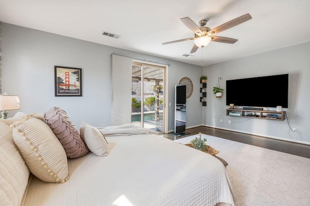 bedroom with ceiling fan, wood-type flooring, and access to outside