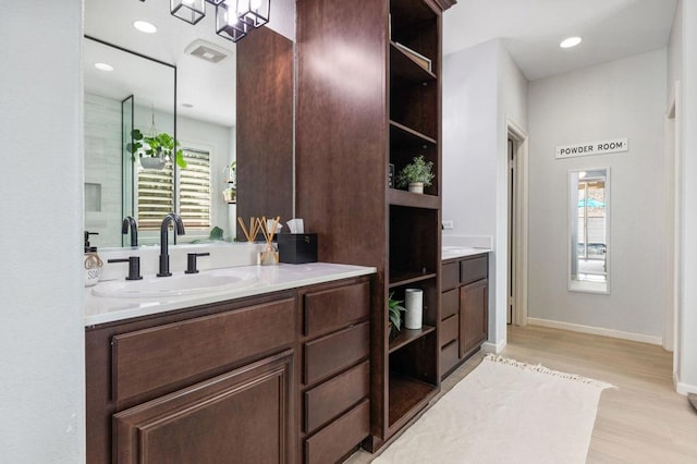 bathroom featuring vanity and hardwood / wood-style floors