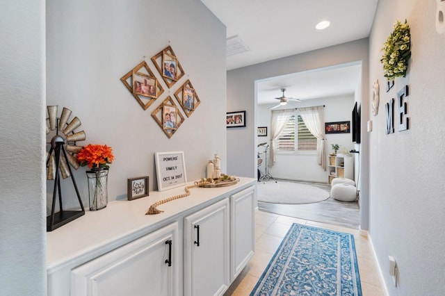 hallway featuring light tile patterned flooring