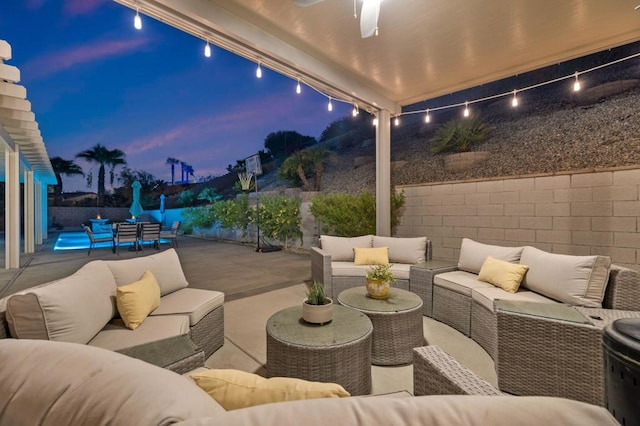 patio terrace at dusk with an outdoor living space