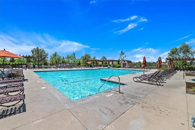 view of swimming pool with a patio area