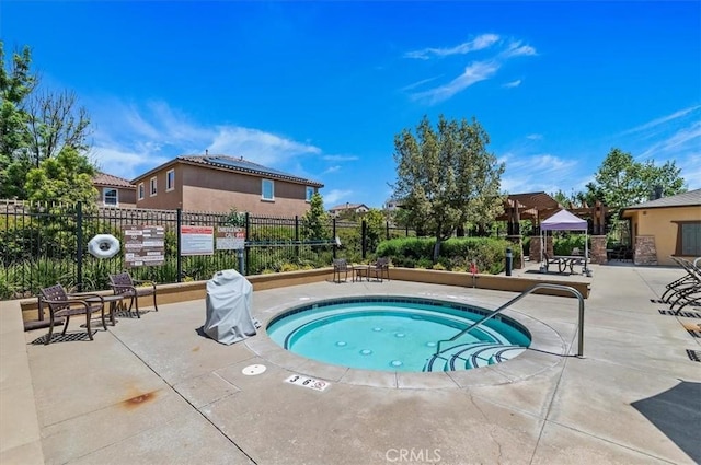 view of pool with a community hot tub