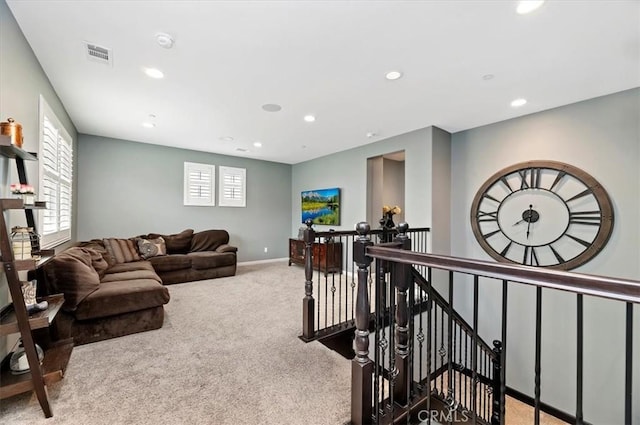 living room featuring light carpet