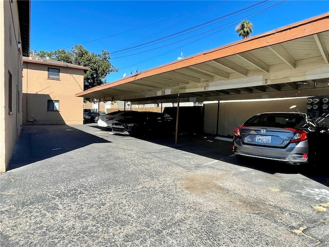 view of parking with a carport