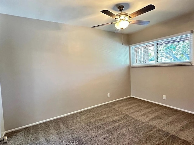 empty room with ceiling fan and carpet floors