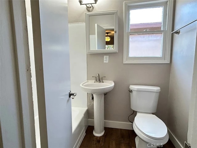 bathroom with separate shower and tub, hardwood / wood-style floors, and toilet