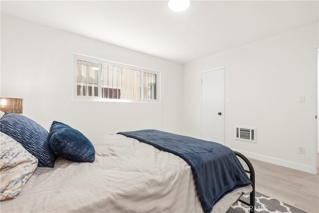 bedroom with light hardwood / wood-style floors