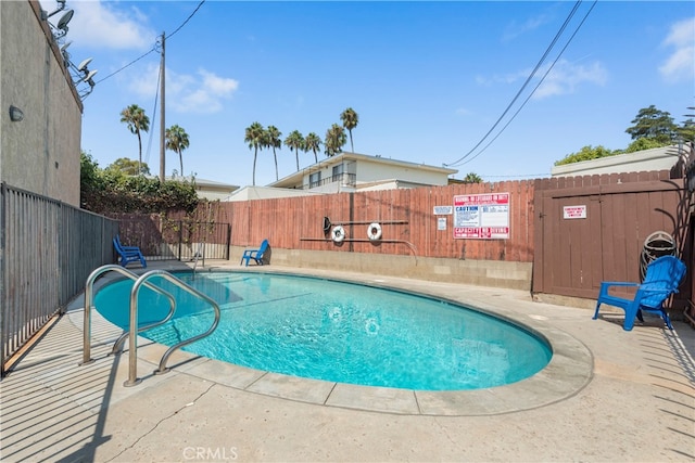 view of swimming pool featuring a patio