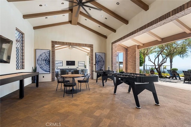 playroom featuring beamed ceiling, ceiling fan, and high vaulted ceiling