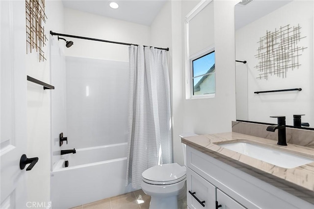 full bathroom with tile patterned flooring, vanity, toilet, and shower / bath combo with shower curtain