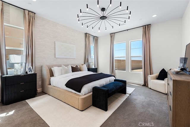 bedroom featuring carpet and a notable chandelier