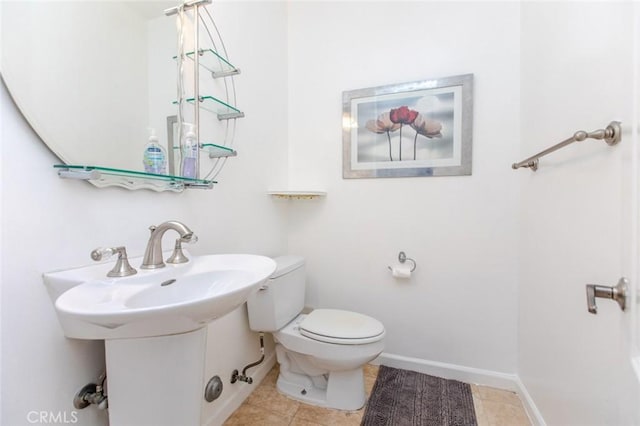 bathroom featuring tile patterned flooring and toilet