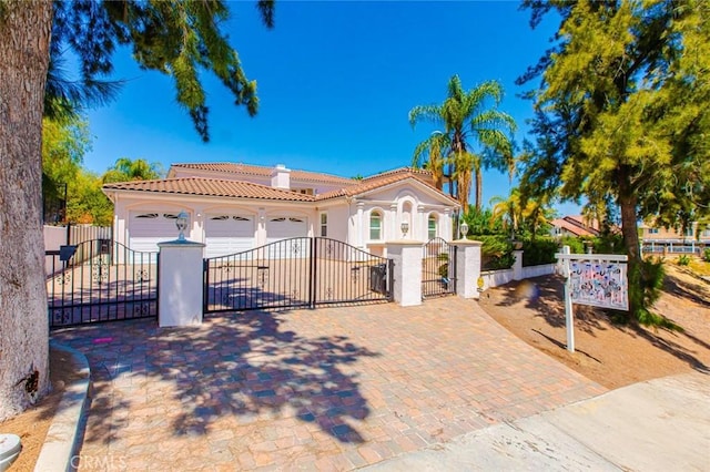 mediterranean / spanish house with a garage