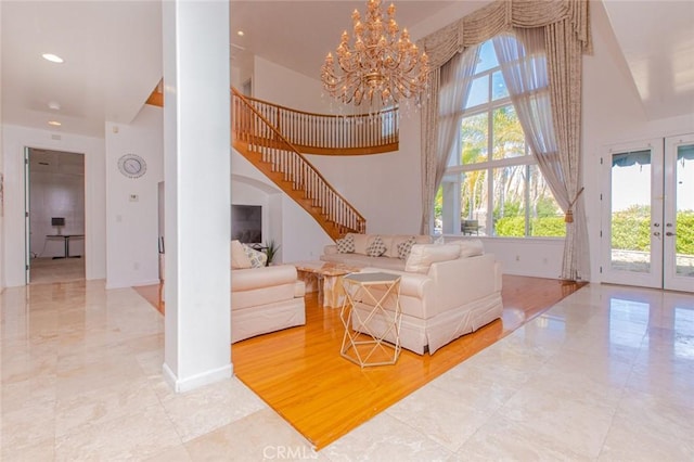 interior space featuring french doors, a chandelier, and light hardwood / wood-style flooring