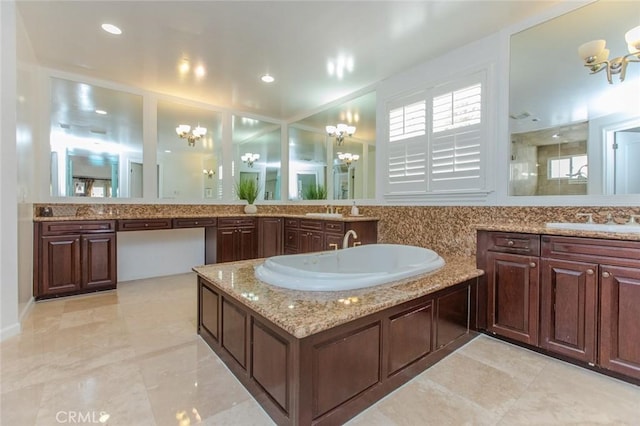 bathroom with vanity and a notable chandelier