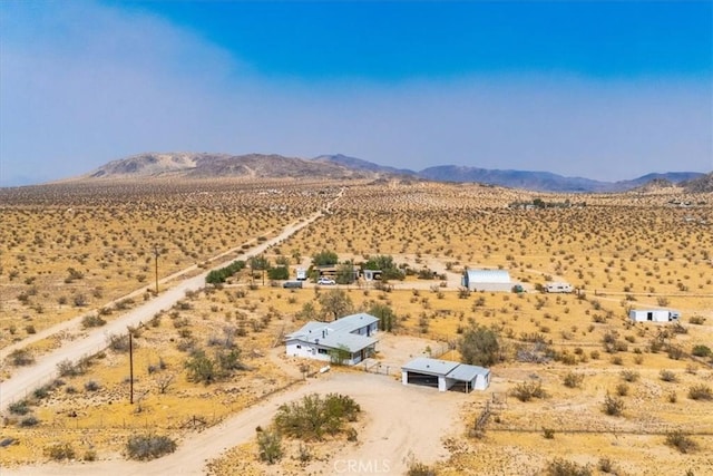 birds eye view of property featuring a mountain view